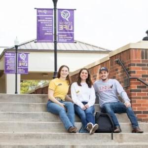 Students sitting on steps.