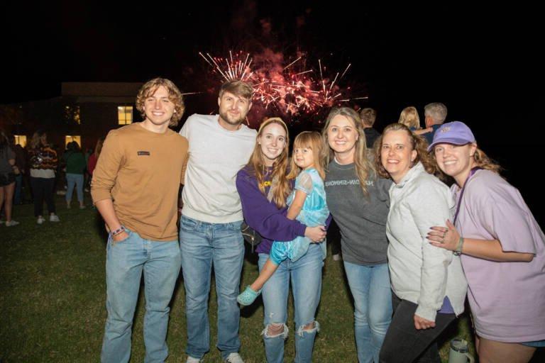 Family at HSU Homecoming 2024 during the fireworks show.