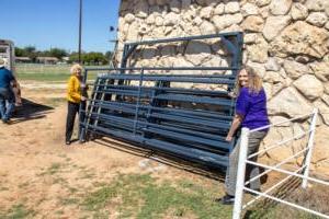 HSU Faculty and Staff at the horse barn unloading equipment